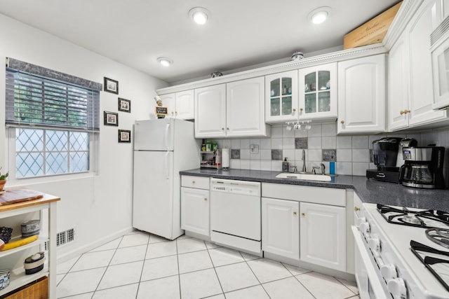74 Bon Aire Cir Unit Q10, Suffern, NY 10901 - kitchen with white appliances, a sink, white cabinetry, and dark countertops