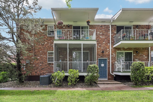 74 Bon Aire Cir Unit Q10, Suffern, NY 10901 - back of property featuring cooling unit, brick siding, and a balcony