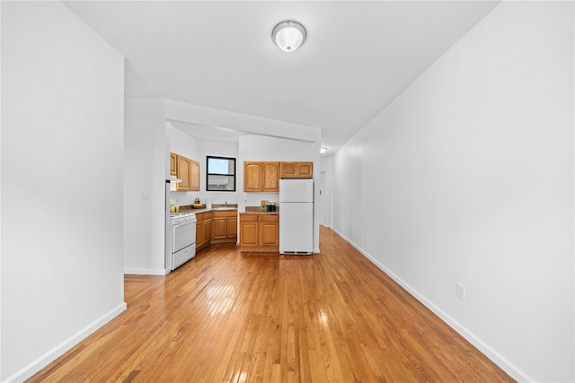 1608 Amsterdam Ave Unit 4B, New York Manhattan, NY 10031 - kitchen featuring white appliances, light wood finished floors, light countertops, baseboards, and a sink