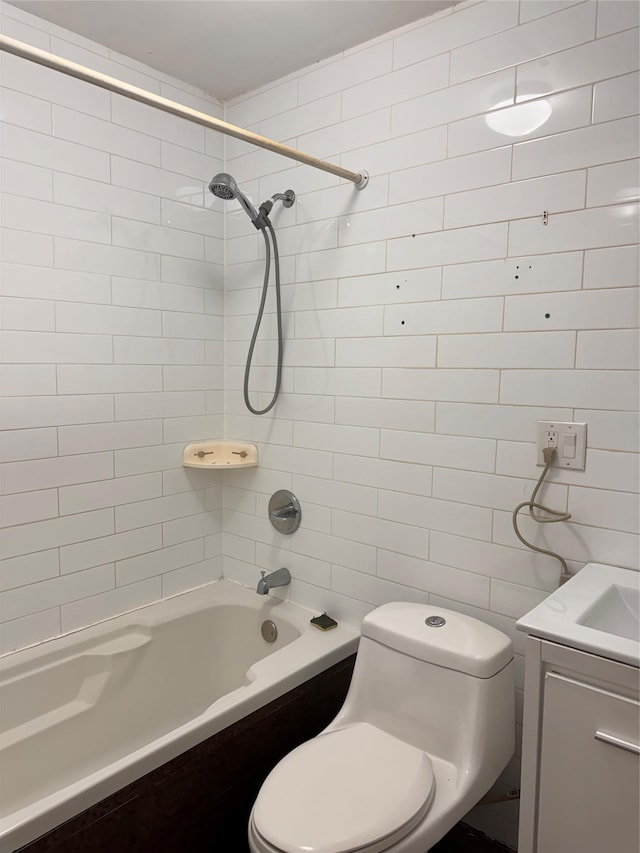 2311 Cortelyou Rd, Brooklyn, NY 11226 - full bathroom featuring tile walls, toilet, shower / tub combination, and vanity