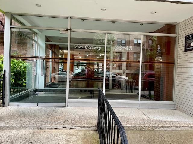 33-45 92nd St Unit 4K, Jackson Heights, NY 11372 - entrance to property with brick siding