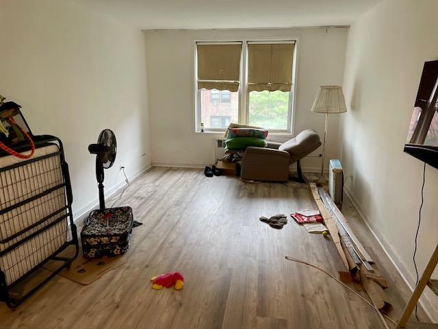 33-45 92nd St Unit 4K, Jackson Heights, NY 11372 - bedroom with wood finished floors and baseboards