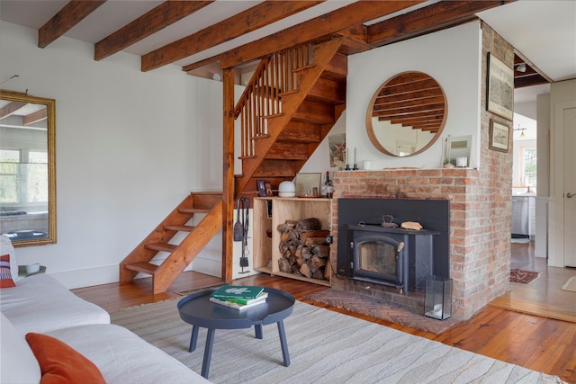 57 Dellenbaugh Rd, Cragsmoor, NY 12566 - living room with stairs, hardwood / wood-style flooring, beamed ceiling, and baseboards