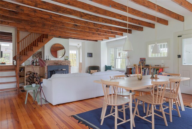 57 Dellenbaugh Rd, Cragsmoor, NY 12566 - dining room with hardwood / wood-style floors, stairway, beamed ceiling, and a brick fireplace