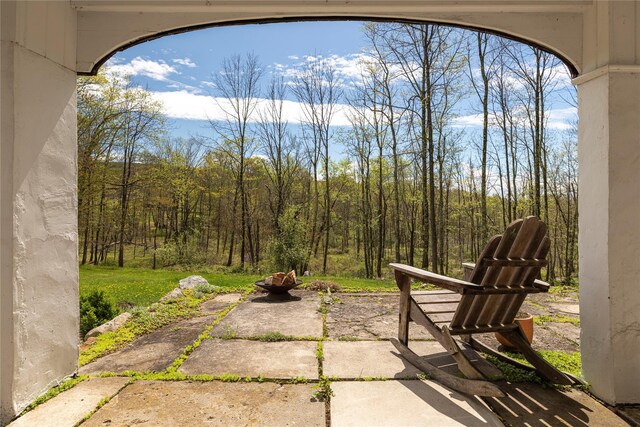57 Dellenbaugh Rd, Cragsmoor, NY 12566 - view of patio / terrace with an outdoor fire pit and a forest view