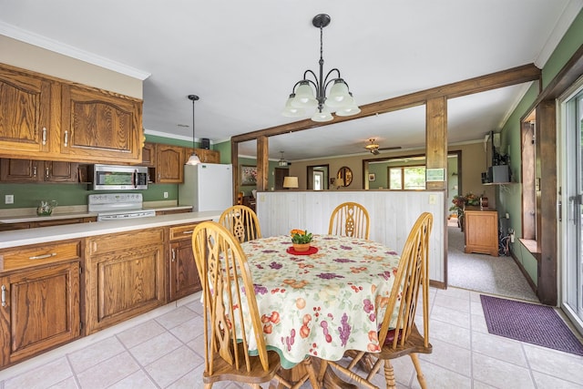 1028 Jackson Corners Rd, Red Hook, NY 12571 - dining room featuring light tile patterned floors, a chandelier, and ornamental molding