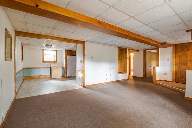 1028 Jackson Corners Rd, Red Hook, NY 12571 - below grade area featuring freestanding refrigerator, a drop ceiling, baseboards, and carpet flooring