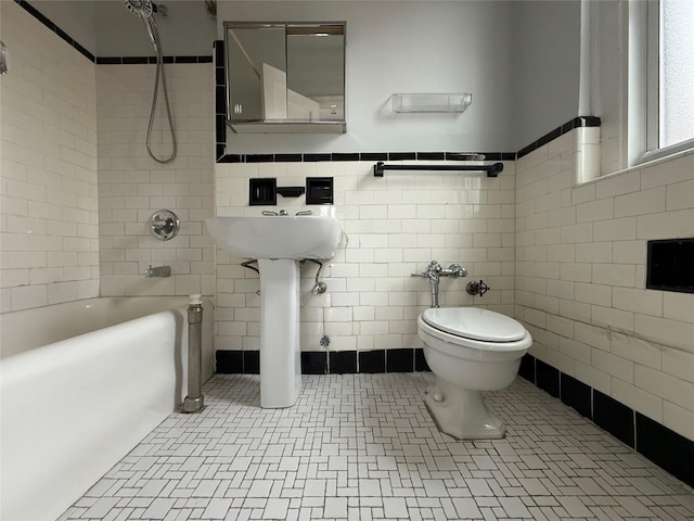 1440 Midland Unit 5F, Bronxville, NY 10708 - full bathroom with tile walls, shower / tub combination, toilet, and a wainscoted wall