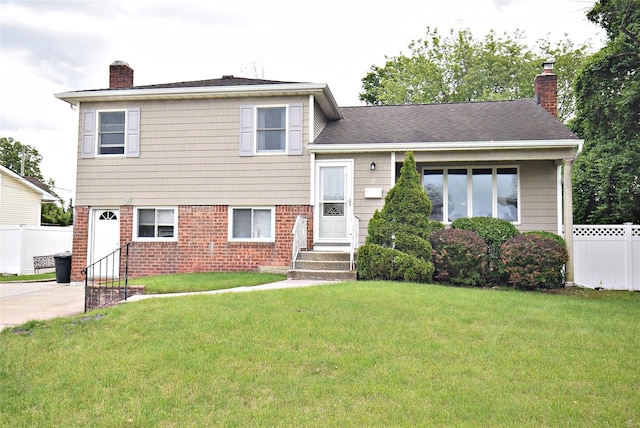 2 Walnut Dr, Syosset, NY 11791 - tri-level home with a chimney, driveway, brick siding, an attached garage, and a shingled roof