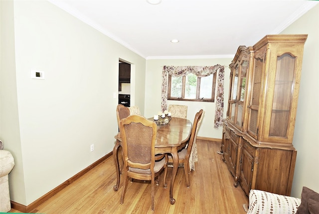 2 Walnut Dr, Syosset, NY 11791 - dining area featuring baseboards, light wood-style flooring, crown molding, and recessed lighting