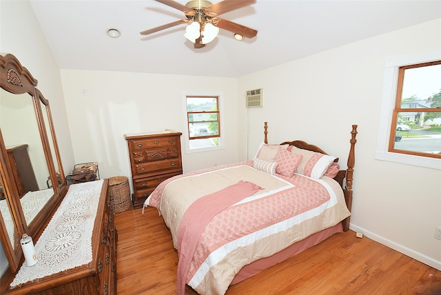 2 Walnut Dr, Syosset, NY 11791 - bedroom with light wood-type flooring, multiple windows, baseboards, and ceiling fan