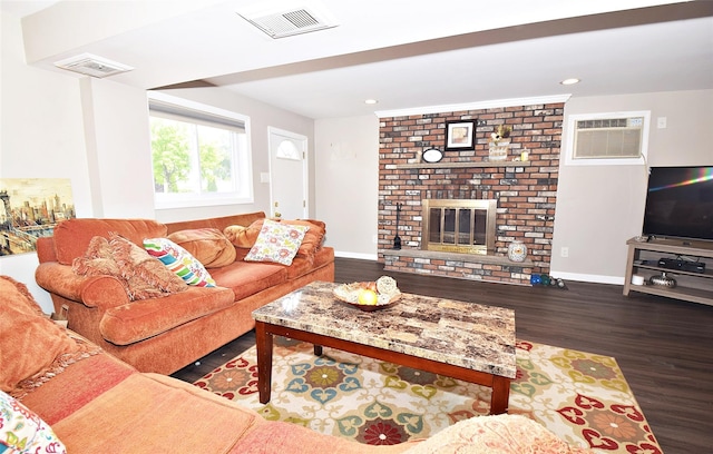 2 Walnut Dr, Syosset, NY 11791 - living room featuring wood finished floors, a wall mounted air conditioner, a fireplace, recessed lighting, and baseboards