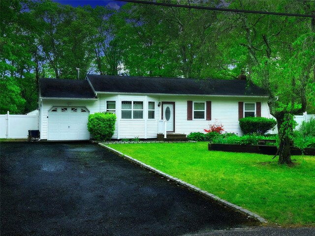 23 Kingsland Ave, Shirley, NY 11967 - single story home featuring an attached garage, asphalt driveway, and a chimney