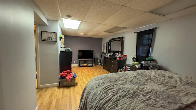 23 Kingsland Ave, Shirley, NY 11967 - bedroom with a drop ceiling, light wood-style flooring, and baseboards