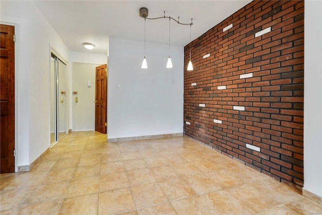 226-26 Union Tpke Unit 1E, Oakland Gardens, NY 11364 - empty room with brick wall and an accent wall