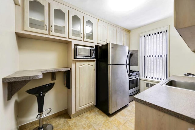226-26 Union Tpke Unit 1E, Oakland Gardens, NY 11364 - kitchen featuring stainless steel appliances, a sink, glass insert cabinets, and baseboards