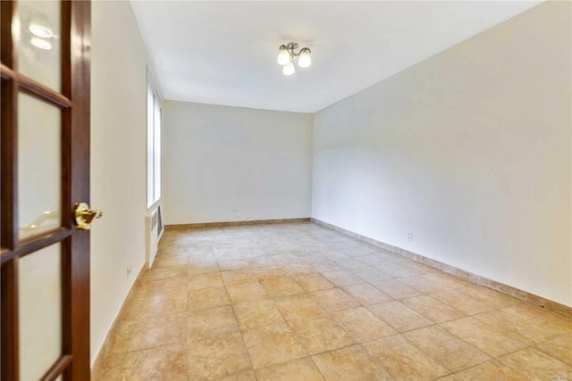 226-26 Union Tpke Unit 1E, Oakland Gardens, NY 11364 - spare room featuring baseboards
