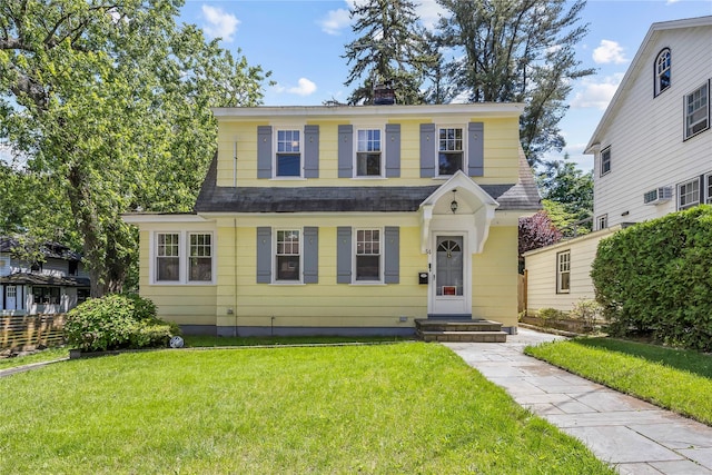 34 Little Neck Rd, Little Neck, NY 11363 - view of front facade with a front yard, a chimney, and roof with shingles