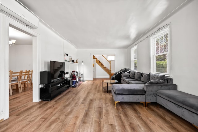 34 Little Neck Rd, Little Neck, NY 11363 - living area with a wall mounted air conditioner, stairs, and light wood finished floors