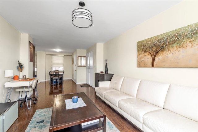 61-15 97th St Unit 6A, Rego Park, NY 11374 - living area with dark wood-style floors and baseboards