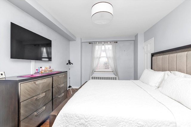 61-15 97th St Unit 6A, Rego Park, NY 11374 - bedroom featuring baseboards and dark wood finished floors