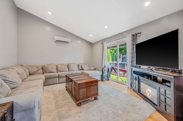 49 Rainbow Ln, Levittown, NY 11756 - living room with a wall mounted AC, vaulted ceiling, wood finished floors, and recessed lighting