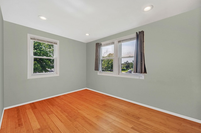 49 Rainbow Ln, Levittown, NY 11756 - unfurnished room featuring baseboards, light wood-type flooring, and recessed lighting