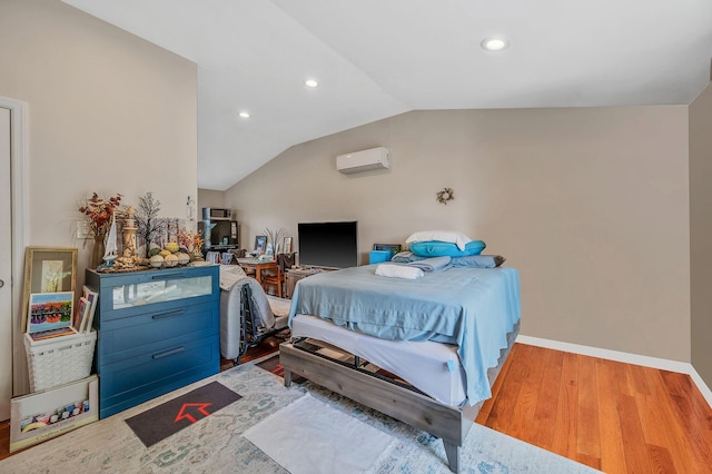 49 Rainbow Ln, Levittown, NY 11756 - bedroom featuring a wall unit AC, lofted ceiling, recessed lighting, wood finished floors, and baseboards