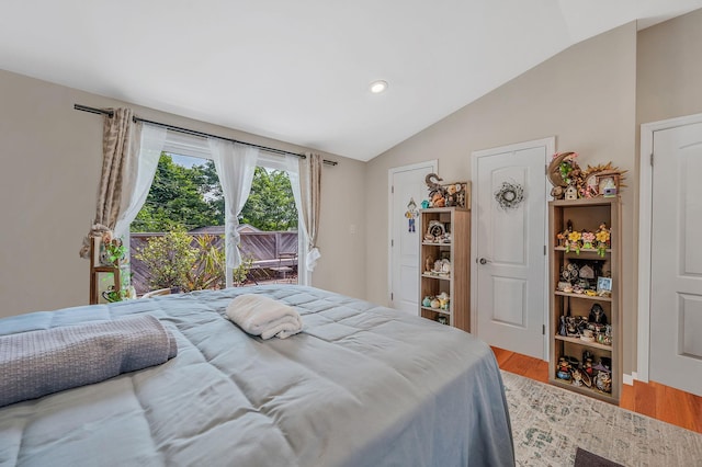 49 Rainbow Ln, Levittown, NY 11756 - bedroom with lofted ceiling, wood finished floors, access to outside, and recessed lighting