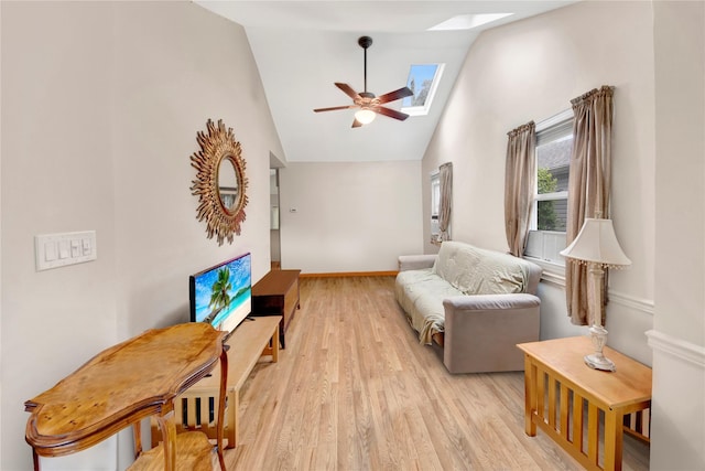 9 Magnolia Pl Unit 1, Bronx, NY 10465 - living room featuring a skylight, high vaulted ceiling, light wood-style floors, ceiling fan, and baseboards