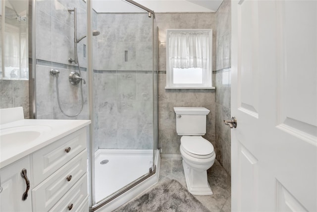 9 Magnolia Pl Unit 1, Bronx, NY 10465 - bathroom with a stall shower, toilet, vanity, tile walls, and tile patterned floors