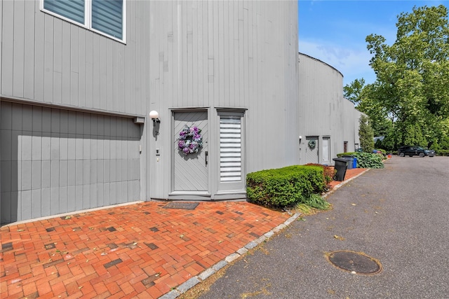16 Sands Ct, Port Washington, NY 11050 - entrance to property with an attached garage