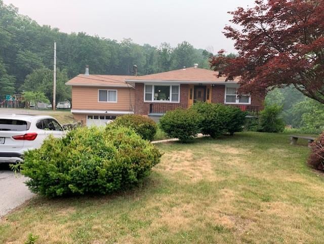 2975 Rte 9, Cold Spring, NY 10516 - ranch-style home with a garage and a front lawn