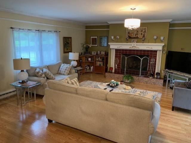 2975 Rte 9, Cold Spring, NY 10516 - living room featuring wood finished floors, crown molding, and a fireplace