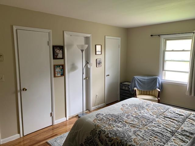 2975 Rte 9, Cold Spring, NY 10516 - bedroom with wood finished floors, baseboards, and baseboard heating