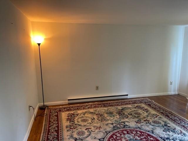 2975 Rte 9, Cold Spring, NY 10516 - empty room featuring a baseboard radiator, wood finished floors, and baseboards