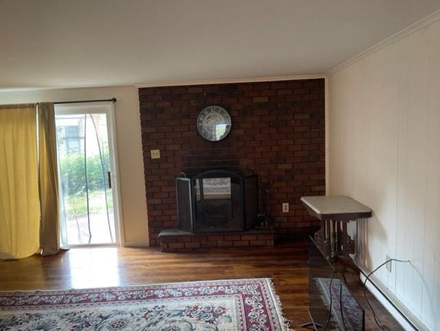 2975 Rte 9, Cold Spring, NY 10516 - living room featuring wood finished floors, a baseboard heating unit, a fireplace, and crown molding