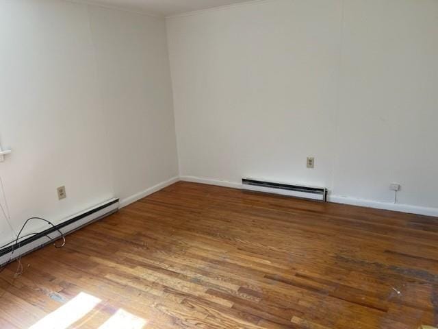 2975 Rte 9, Cold Spring, NY 10516 - spare room with baseboard heating, wood finished floors, baseboards, and crown molding