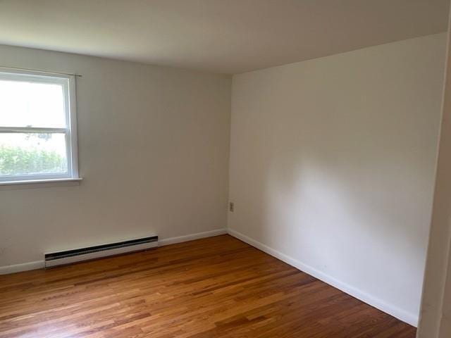 2975 Rte 9, Cold Spring, NY 10516 - unfurnished room featuring a baseboard radiator, wood finished floors, and baseboards