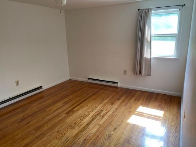 2975 Rte 9, Cold Spring, NY 10516 - empty room featuring a baseboard radiator, wood finished floors, baseboards, baseboard heating, and a ceiling fan
