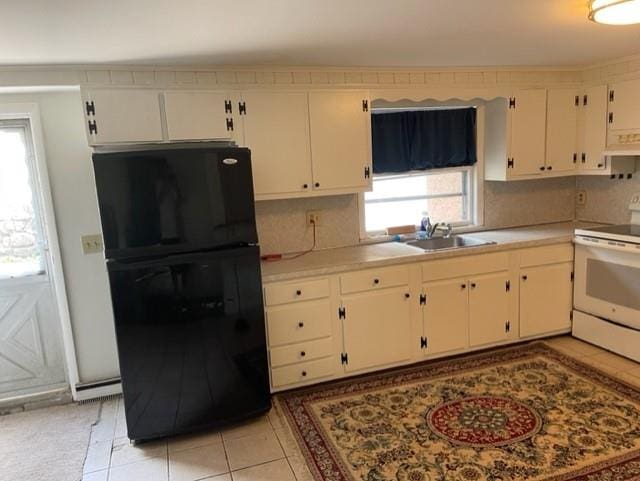 2975 Rte 9, Cold Spring, NY 10516 - kitchen with freestanding refrigerator, electric stove, a sink, light tile patterned flooring, and light countertops