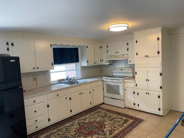 2975 Rte 9, Cold Spring, NY 10516 - kitchen featuring white electric range oven, freestanding refrigerator, under cabinet range hood, a sink, and light countertops