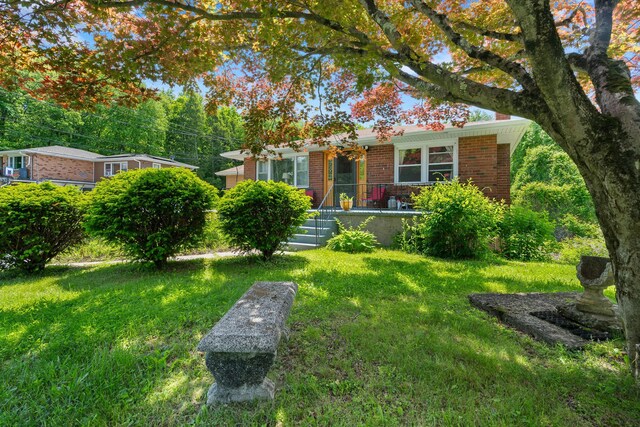 2975 Rte 9, Cold Spring, NY 10516 - single story home with brick siding, a front lawn, and a chimney