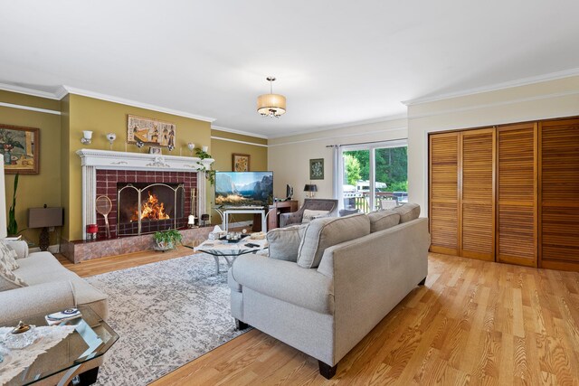 2975 Rte 9, Cold Spring, NY 10516 - living room featuring light wood-style floors, crown molding, and a tile fireplace
