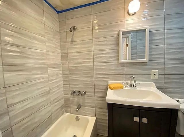 5840 Catalpa Ave, Ridgewood, NY 11385 - bathroom with  shower combination, vanity, and tile walls