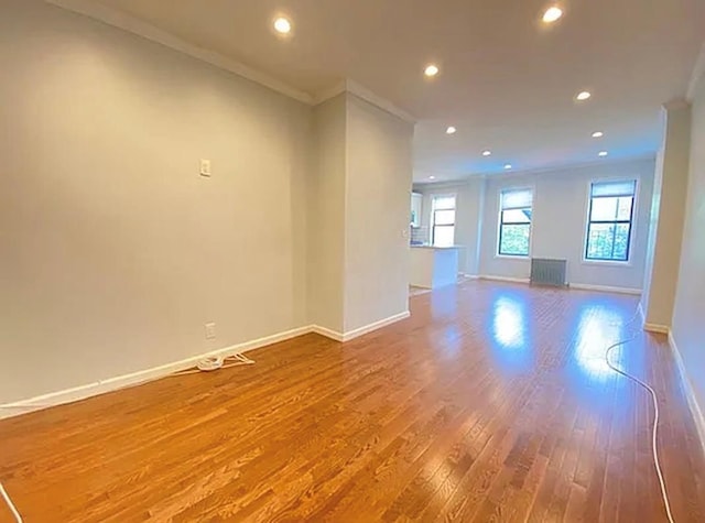 5840 Catalpa Ave, Ridgewood, NY 11385 - unfurnished room featuring ornamental molding, wood finished floors, baseboards, and recessed lighting