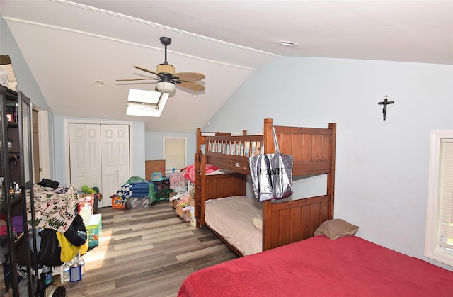 1330 William Floyd Pkwy, Shirley, NY 11967 - bedroom featuring vaulted ceiling, wood finished floors, a skylight, a ceiling fan, and a closet