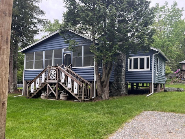 23 N Seminole Trl, Bethel, NY 12778 - back of property featuring stairway, a sunroom, a yard, and log veneer siding