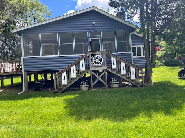 23 N Seminole Trl, Bethel, NY 12778 - rear view of house featuring a sunroom, stairs, a chimney, and a lawn