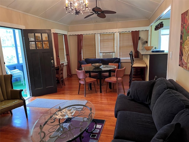 23 N Seminole Trl, Bethel, NY 12778 - living area featuring crown molding, wood finished floors, ceiling fan, lofted ceiling, and a chandelier